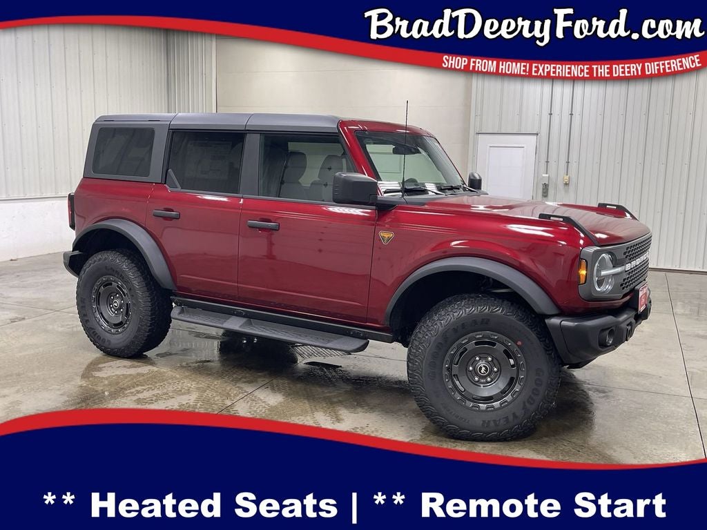 2025 Ford Bronco Badlands in Ruby Red Metallic Tinted Clearcoat — front three-quarter view